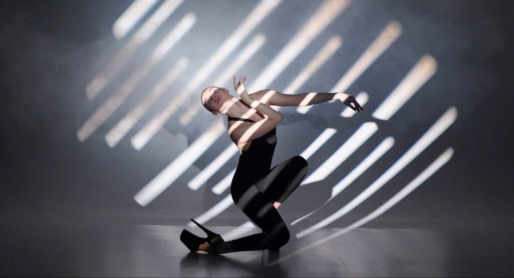 frame up dancer in high heels and black outfit